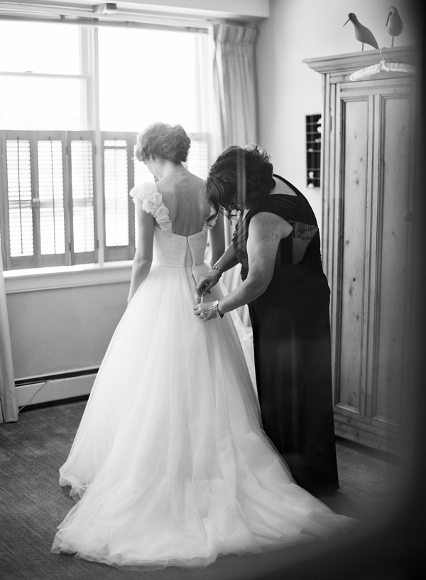 mom helping with wedding gown